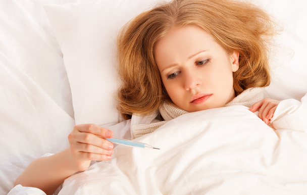 Woman with thermometer sick colds, flu, fever in bed - Photo, Image