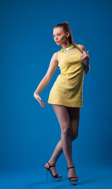 Graceful girl posing with disco makeup in studio - Foto, Imagem