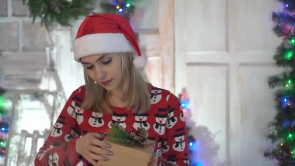 Young Woman Holding And Open Holiday Present In Hands For Christmas. - Video, Çekim