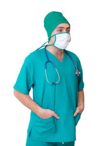 portrait of doctor in mask and green uniform isolated on white b - Foto, Imagen