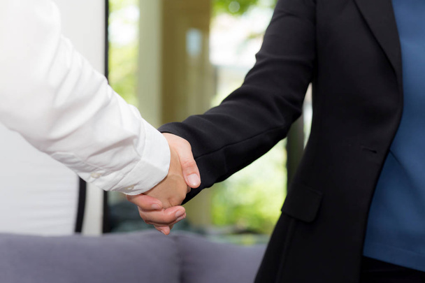 Handshake of businessman and businesswoman after successful busi - Фото, зображення