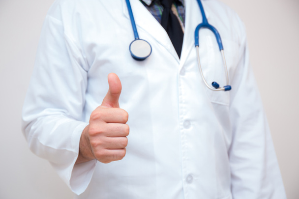 close up of male doctor hand showing thumbs up. - Φωτογραφία, εικόνα