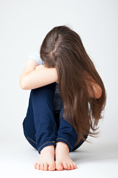Young girl sitting being sad - Foto, Bild
