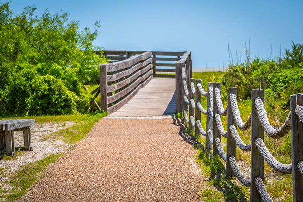 A very long boardwalk surrounded by shrubs in Aransas NWR, Texas - Photo, Image