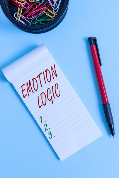 Writing note showing Emotion Logic. Business photo showcasing Heart or Brain Soul or Intelligence Confusion Equal Balance Notebook and stationary with mouse above pastel backdrop. - Photo, Image