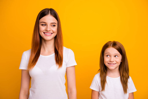 Portrait of lovely ladies looking with beaming smile isolated over yellow background - Fotografie, Obrázek