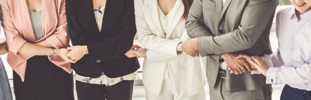 Business people holding hands together teamwork. - Foto, afbeelding