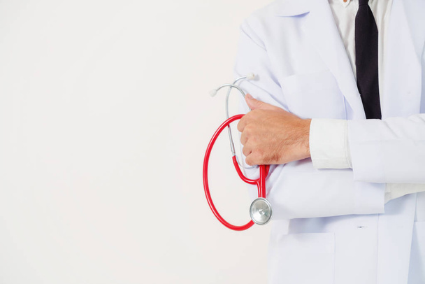 Doctor holding stethoscope on white background. - Photo, Image