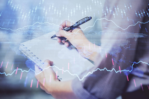 Multi exposure of hands making notes with forex chart huds. Stock market concept. - Fotoğraf, Görsel