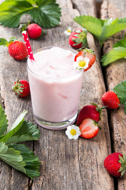 Fresh milk, strawberry on wooden table, assorted protein cocktails with fresh fruits. Natural background - Фото, зображення