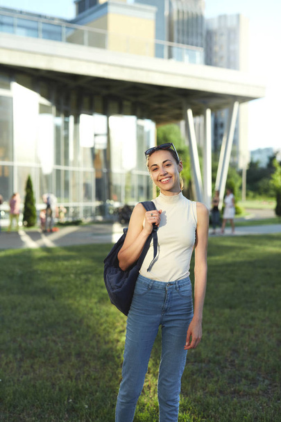Portrait of smiling female student with a backpack going to college. - Photo, image