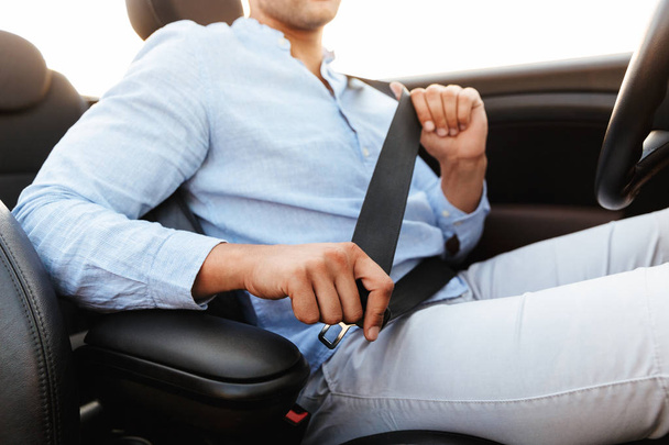 Cropped photo of young man wearing seat belt while driving conve - Fotoğraf, Görsel