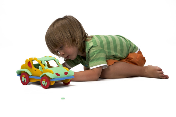 Boy at play with set of rubber foam toys - Foto, Imagen