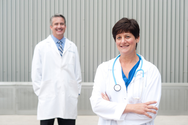 mature female doctor with colleague - Photo, Image