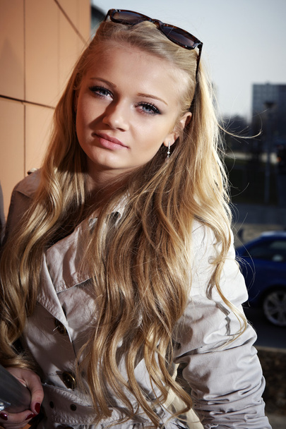 Young blonde beautiful lady on city stairs posing for beauty shots - Valokuva, kuva