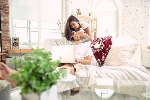 Couple of lovers at home relaxing together, comfortable - Фото, зображення