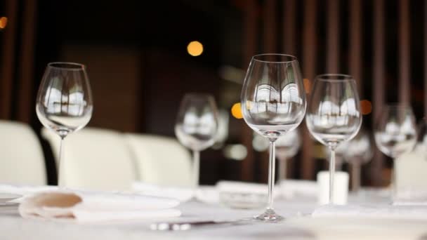 Wineglasses for wine stand on table, closeup - Felvétel, videó