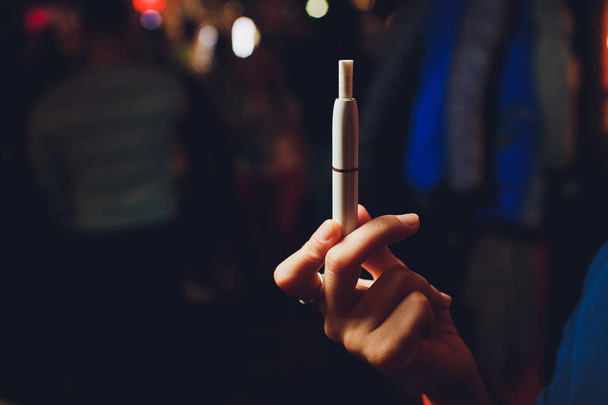 heat-not-burn tobacco product technology. e-cigarette before smoking. - Photo, Image