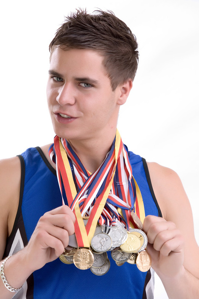 Sports man with lot of medals - 写真・画像