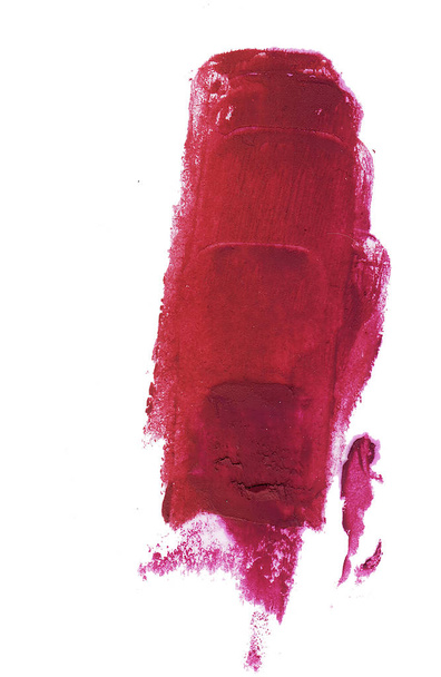 Rode lippenstift uitstrijkje geïsoleerd op witte achtergrond. - Foto, afbeelding