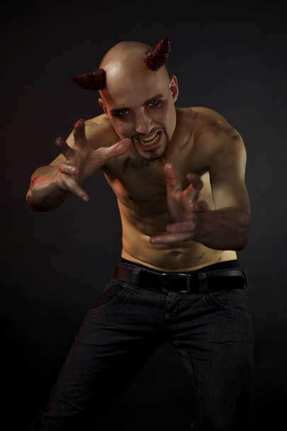 Man posing in styling of devil - Zdjęcie, obraz