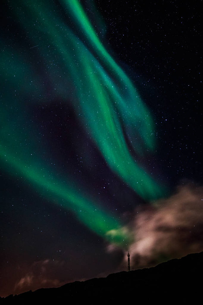 Green Aurora Borealis Northern lights shining with starlit sky,  - Photo, Image