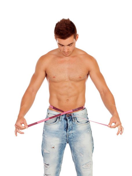 Men with perfect abs measuring his waist - Foto, immagini