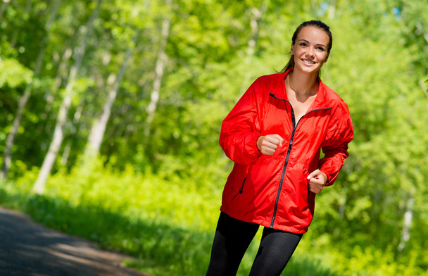 healthy young female athlete running - Фото, изображение
