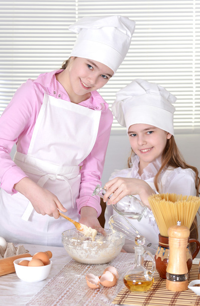 Young girls cook - Photo, image