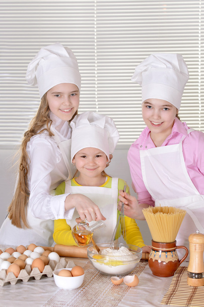 Girls baking a cake - Photo, image