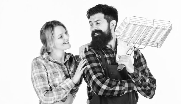 Tools for roasting meat. Man bearded hipster and girl. Preparation and culinary. Family weekend. Couple in love hold kitchen utensils. Picnic barbecue. food cooking. Loving everything about her - Фото, зображення