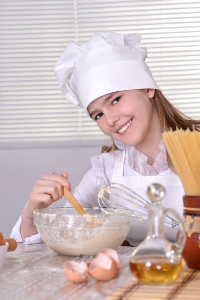 Girl cook the dough - Фото, изображение