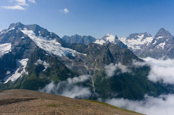 Northern great caucasus mountains near dombay with glaciers and snow in august 2019, original raw picture - Foto, immagini