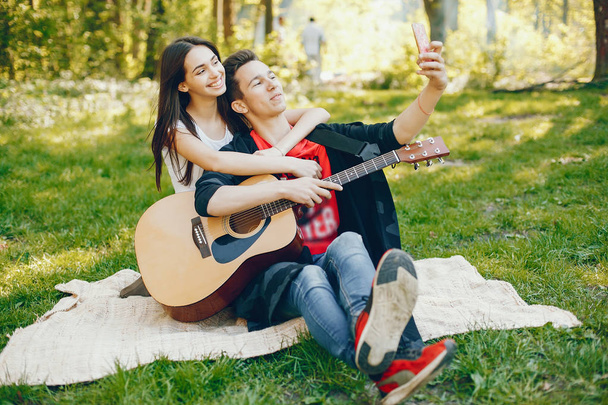 Couple with a guitar - Foto, afbeelding