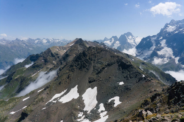 Northern great caucasus mountains near dombay with glaciers and snow in august 2019, original raw picture - Photo, Image