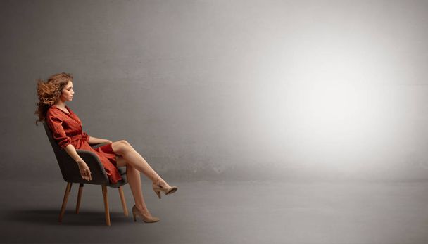 Elegant woman modeling in an empty studio - Photo, Image