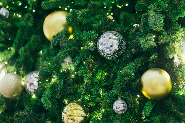 Closeup of Colorful balls on Green Christmas tree background Dec - Valokuva, kuva