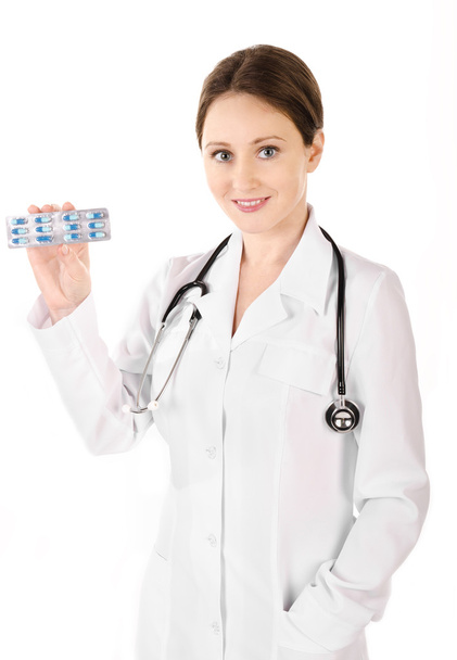 Smiling young doctor woman holding tablets isolated - Foto, Imagem