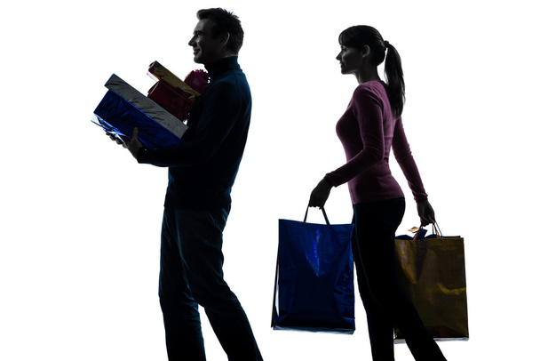 Couple woman man christmas present shopping silhouette - Foto, afbeelding