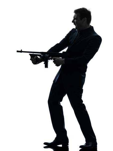 gangster man holding thompson machine gun silhouette - Fotoğraf, Görsel