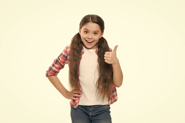 Deal with tangled hair. Girl cute kid with ponytails isolated on white. Tangled hair remedies. Barber salon and hair care. Conditioner oil or nourishing mask before brushing. How to comb long hair - Photo, Image