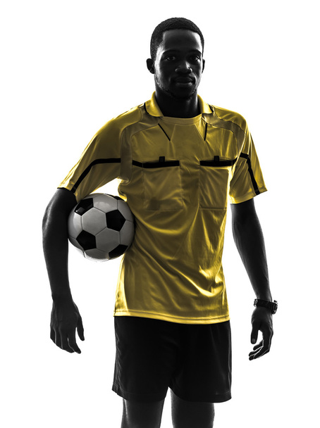 one african man referee standing holding football silhouette - Foto, imagen