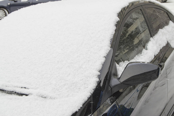 Windshield of the car swept by snow, winter background outdoors - Photo, Image
