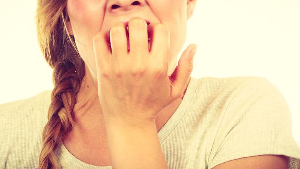 Scared, stressed woman biting her nails - Foto, Imagem