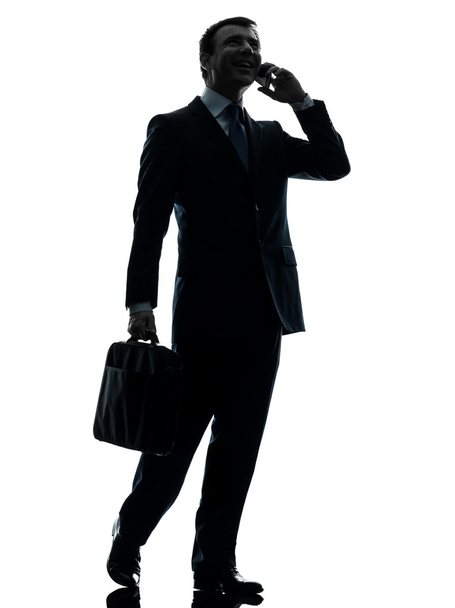 business man walking on the telephone silhouette - Фото, зображення