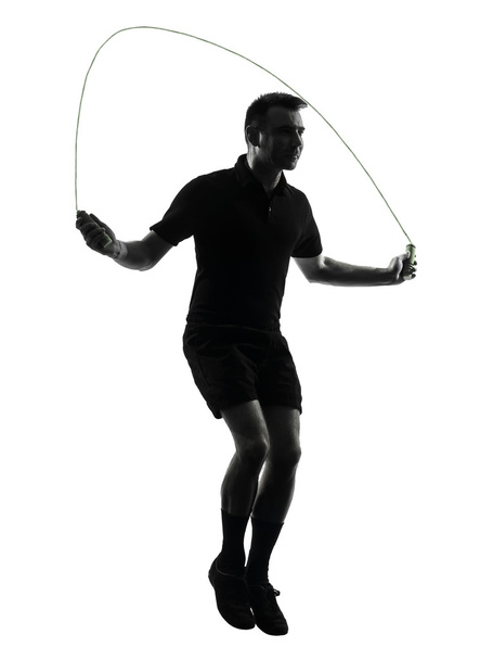 man exercising jumping rope silhouette - 写真・画像
