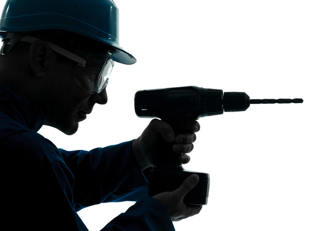 man construction worker holding drill silhouette - Foto, imagen