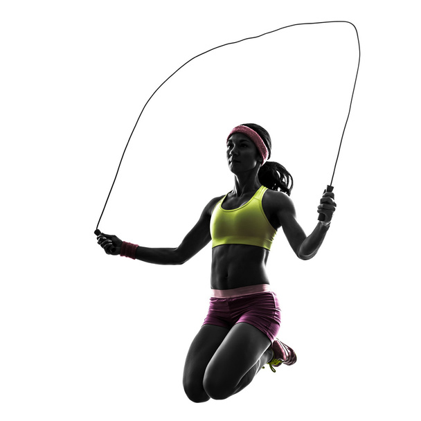 woman exercising fitness jumping rope silhouette - Foto, immagini
