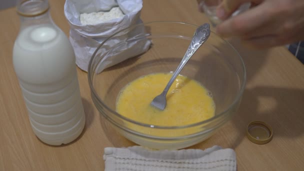 Add and mix salt for pancake dough. - Кадри, відео