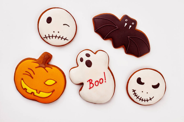 Assorted Halloween cookies on white background. - Fotografie, Obrázek